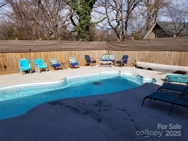 a view of a backyard with a patio