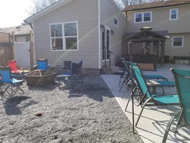 a view of a patio with couple of chairs