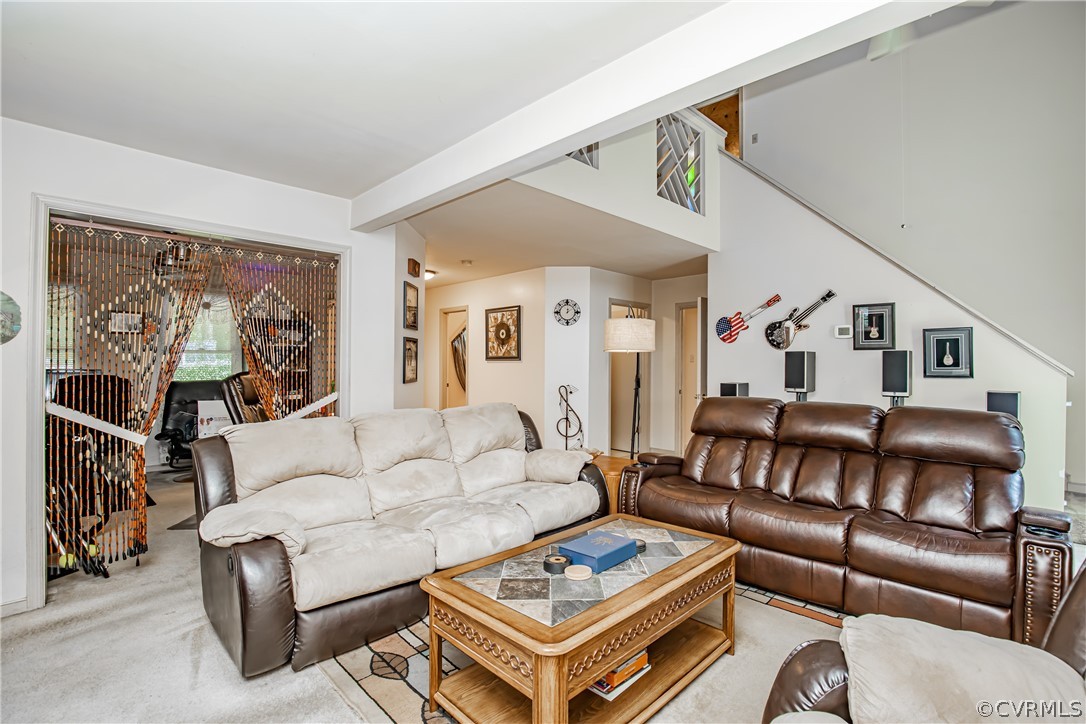 12137 Quito Road Midlothian, VA 23112 - Photo 12 of 34 a living room with furniture a couch and a wall painting