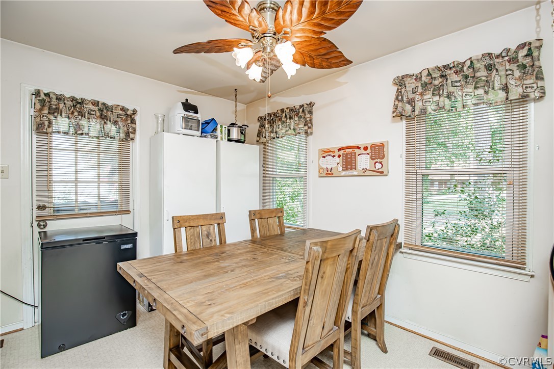12137 Quito Road Midlothian, VA 23112 - Photo 16 of 34 a view of a dining room with furniture window and outside view
