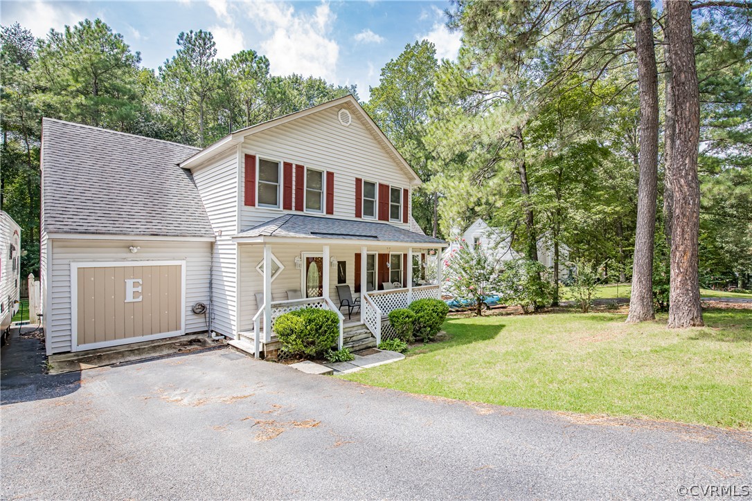 12137 Quito Road Midlothian, VA 23112 - Photo 2 of 34 a front view of a house with garden