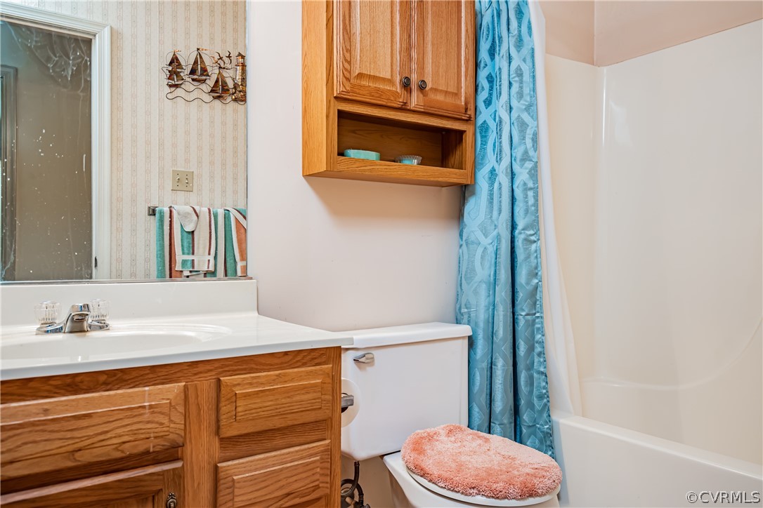 12137 Quito Road Midlothian, VA 23112 - Photo 21 of 34 a bathroom with a sink a toilet and shower