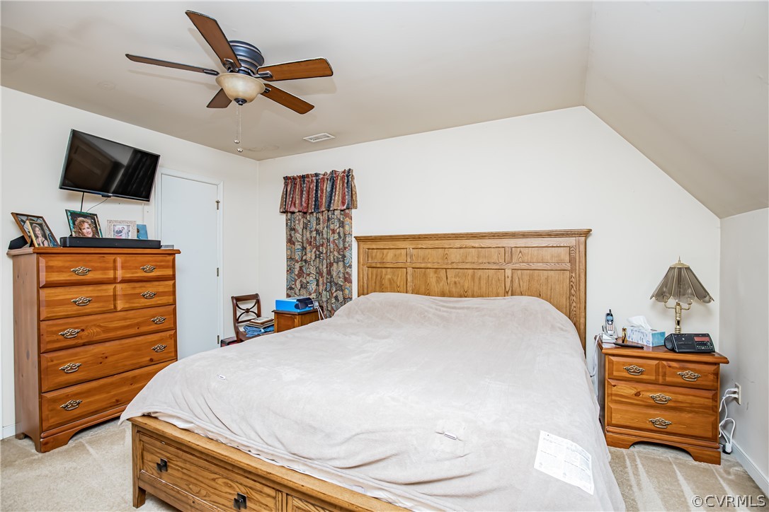 12137 Quito Road Midlothian, VA 23112 - Photo 22 of 34 a bedroom with a bed and flat screen tv