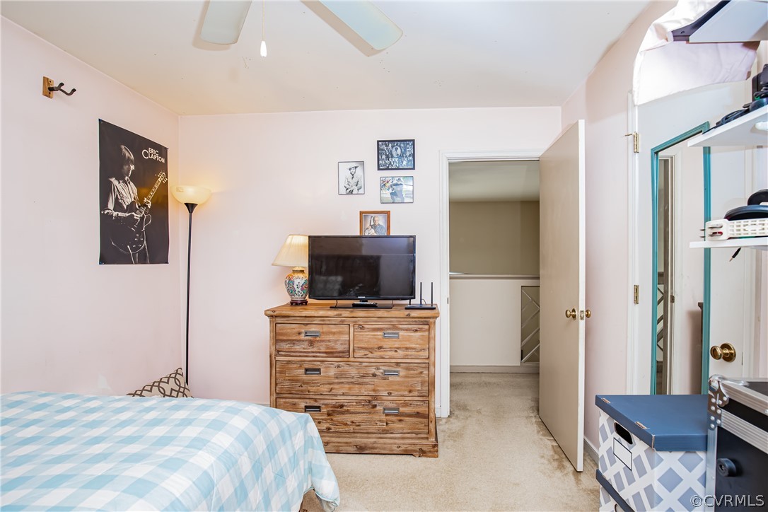 12137 Quito Road Midlothian, VA 23112 - Photo 26 of 34 a bedroom with a bed and a television