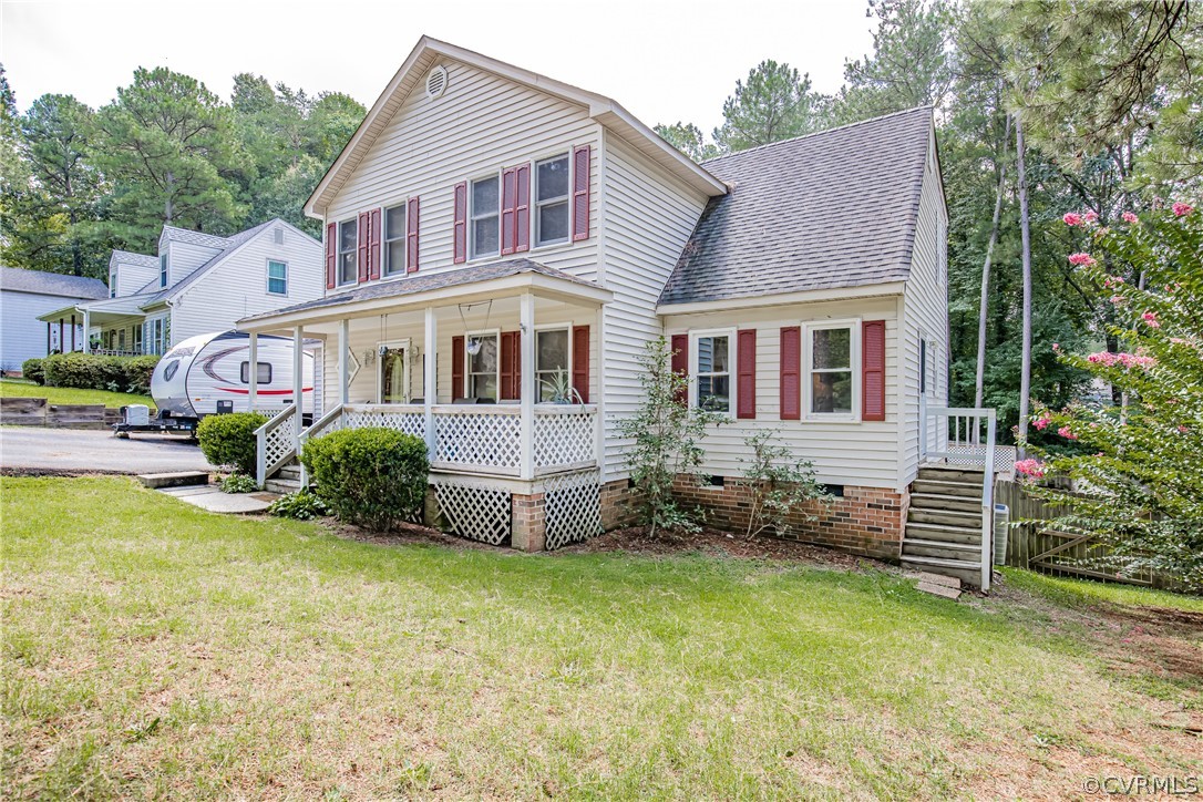 12137 Quito Road Midlothian, VA 23112 - Photo 3 of 34 a front view of a house with garden