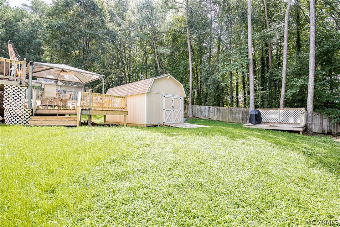 12137 Quito Road Midlothian, VA 23112 - Photo 31 of 34 a view of a house with a yard and sitting area