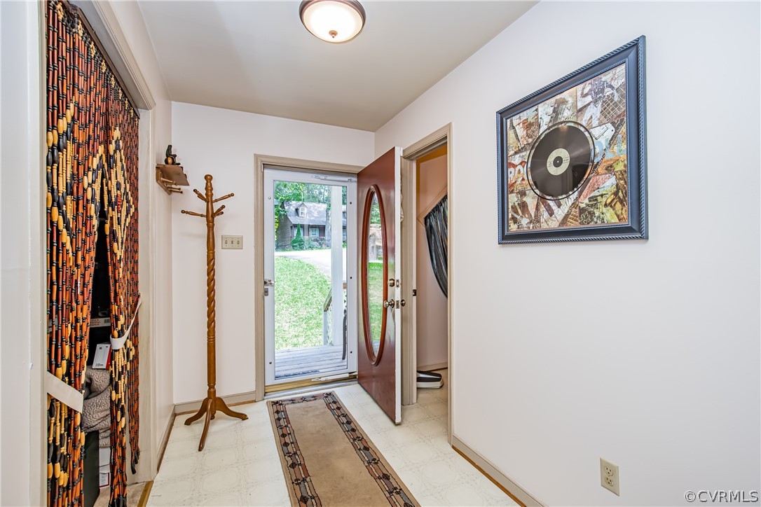 12137 Quito Road Midlothian, VA 23112 - Photo 5 of 34 a view of a hallway with paintings on the wall
