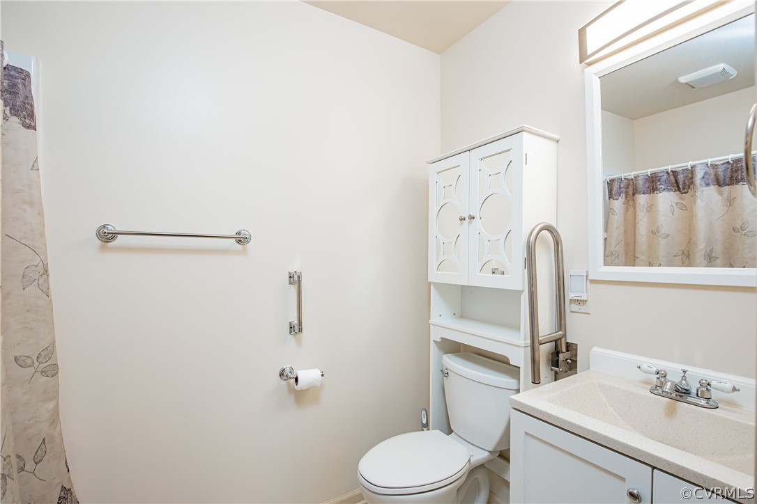 12137 Quito Road Midlothian, VA 23112 - Photo 9 of 34 a bathroom with a sink vanity mirror and toilet