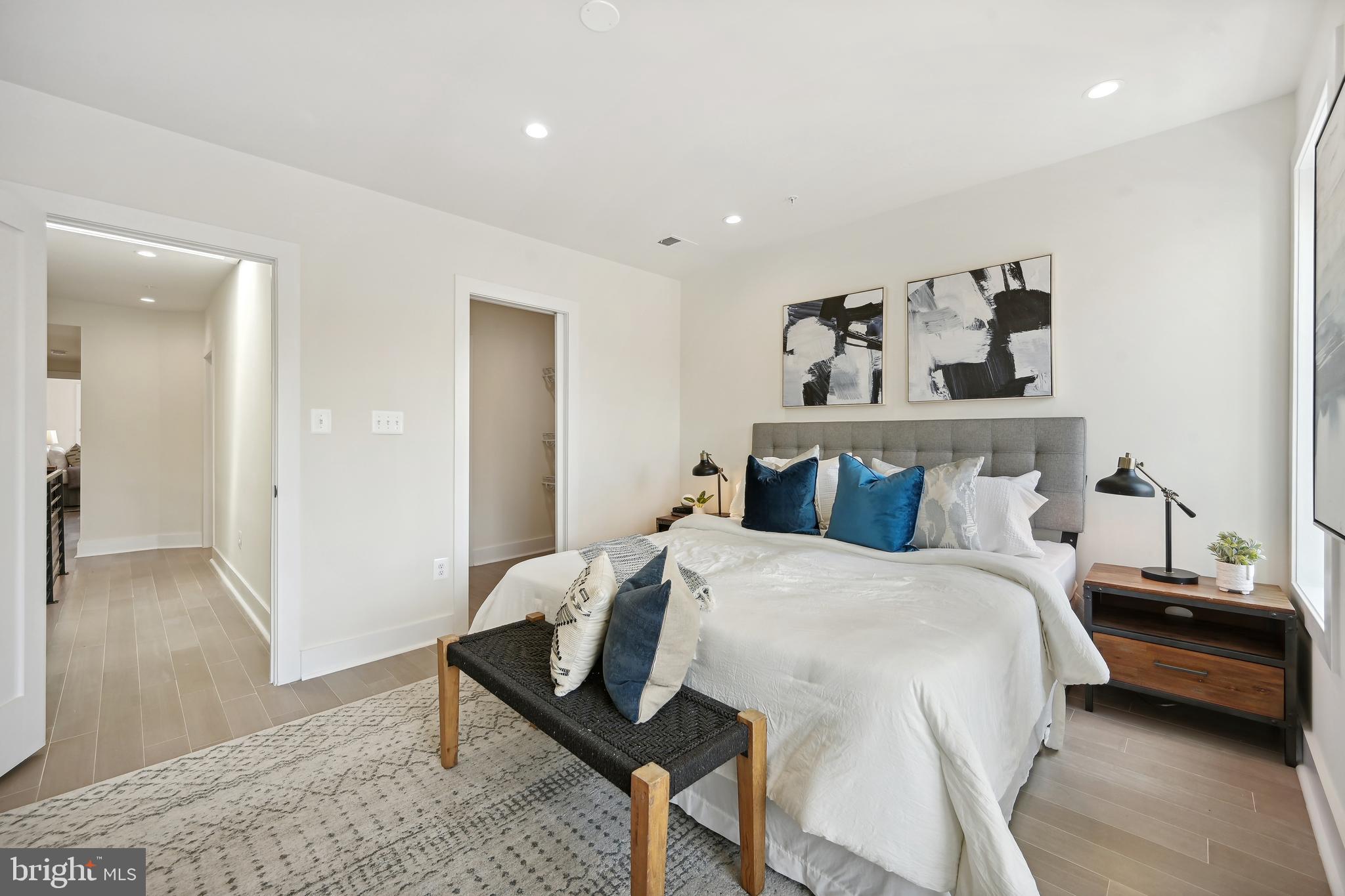 3657 13th Street Northwest Washington, DC 20010 - Photo 11 of 35 a bedroom with a bed and wooden floor