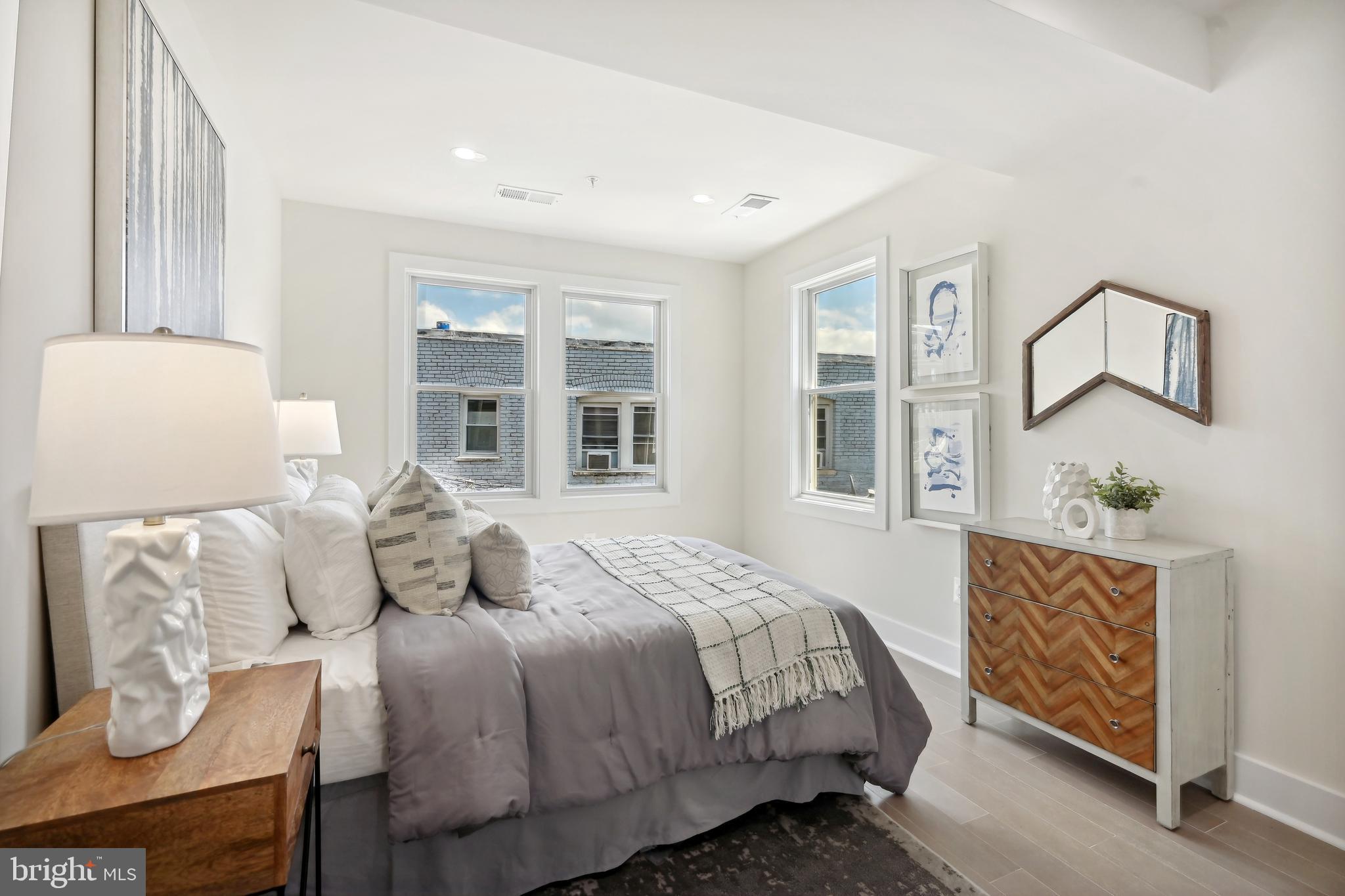 3657 13th Street Northwest Washington, DC 20010 - Photo 13 of 35 a bedroom with a bed and wooden floor