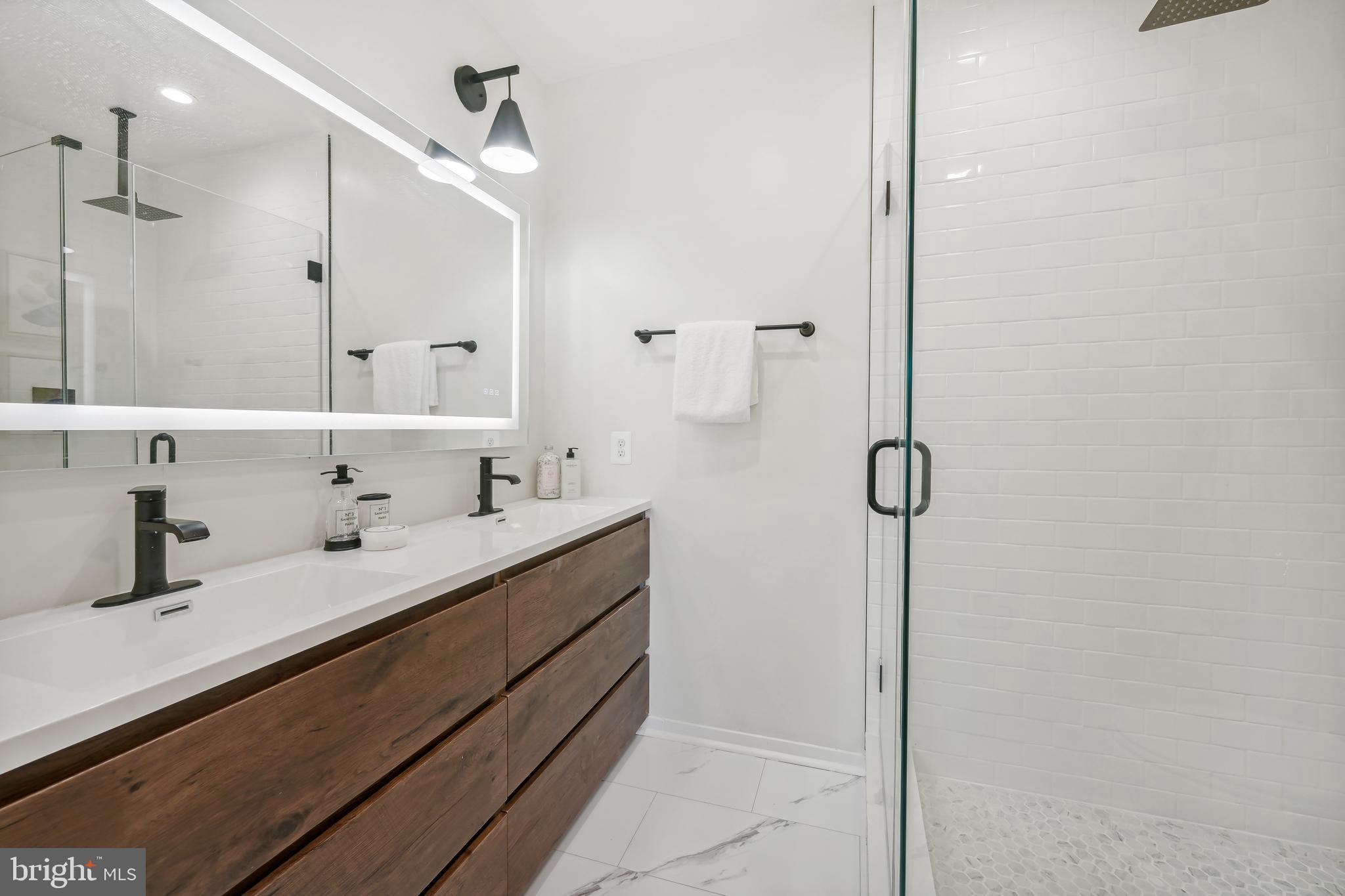 3657 13th Street Northwest Washington, DC 20010 - Photo 20 of 35 a bathroom with 2 sink and a mirror