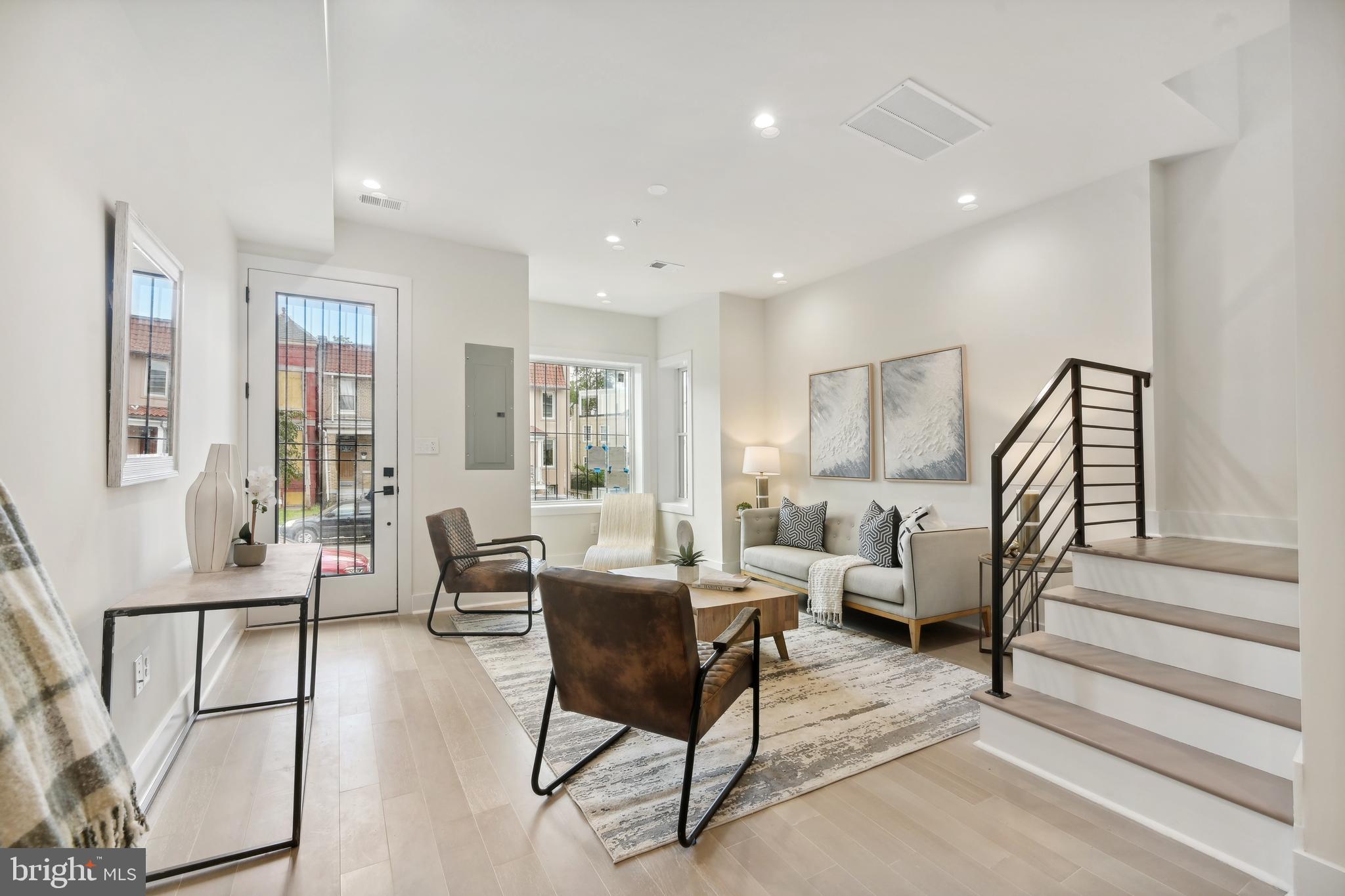 3657 13th Street Northwest Washington, DC 20010 - Photo 2 of 35 a living room with furniture and wooden floor