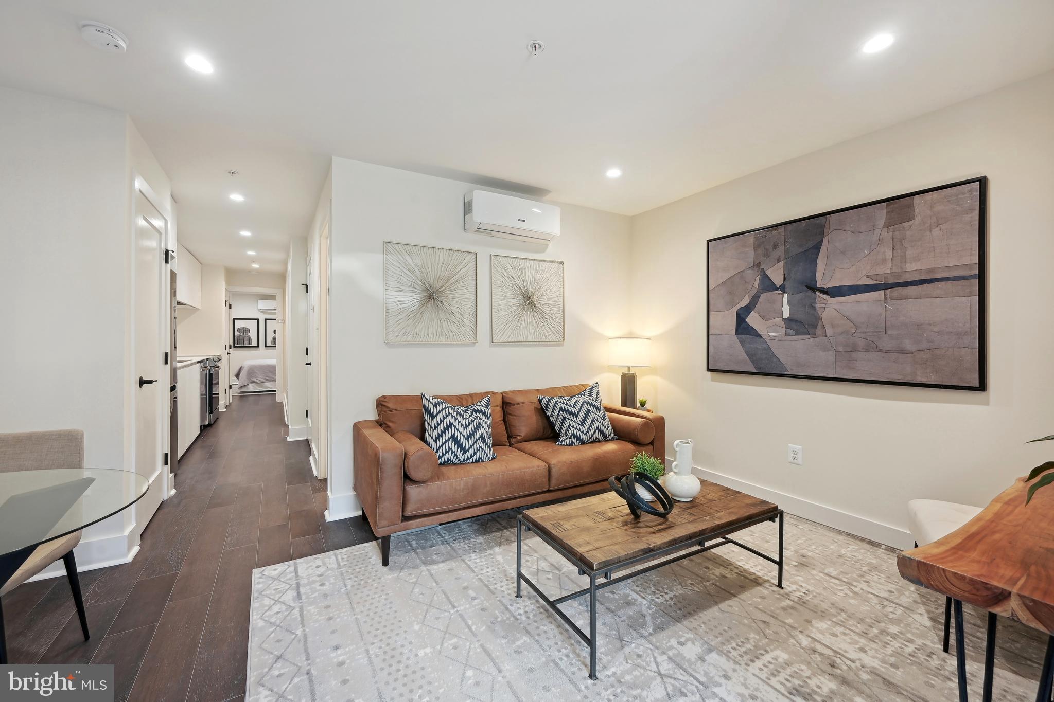 3657 13th Street Northwest Washington, DC 20010 - Photo 21 of 35 a living room with furniture and a painting on the wall