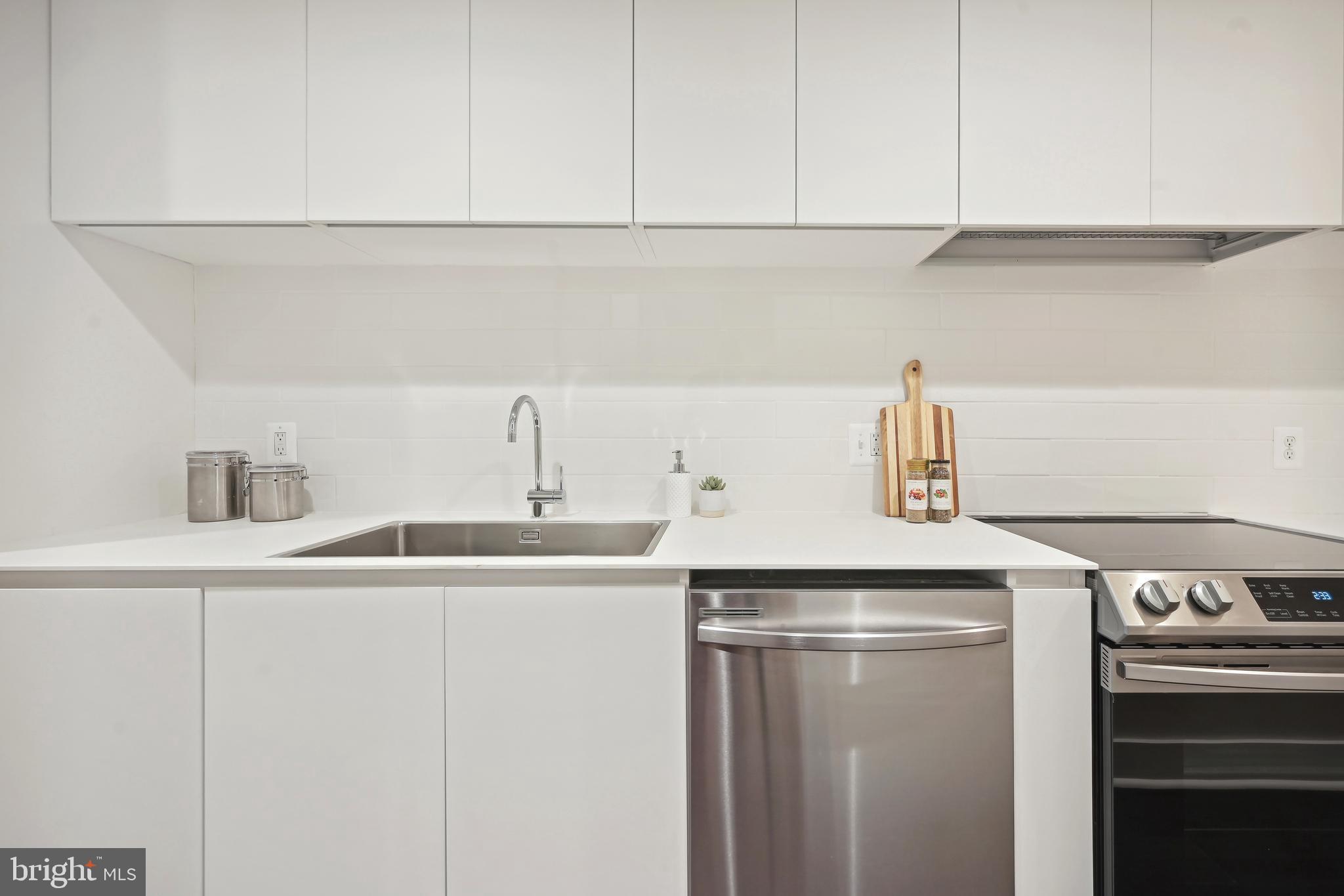 3657 13th Street Northwest Washington, DC 20010 - Photo 25 of 35 a kitchen with a sink and cabinets