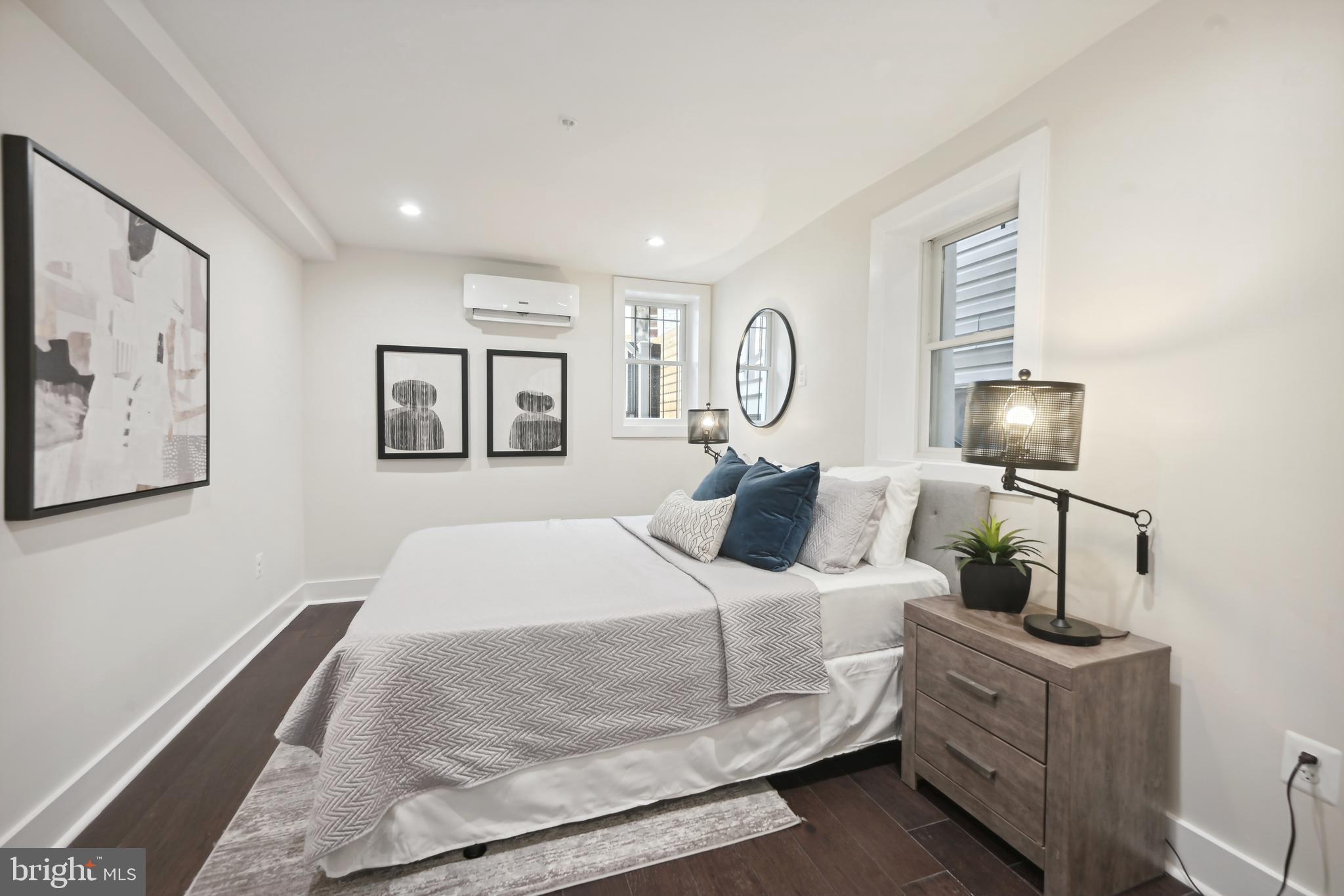 3657 13th Street Northwest Washington, DC 20010 - Photo 27 of 35 a bedroom with a bed and wooden floor