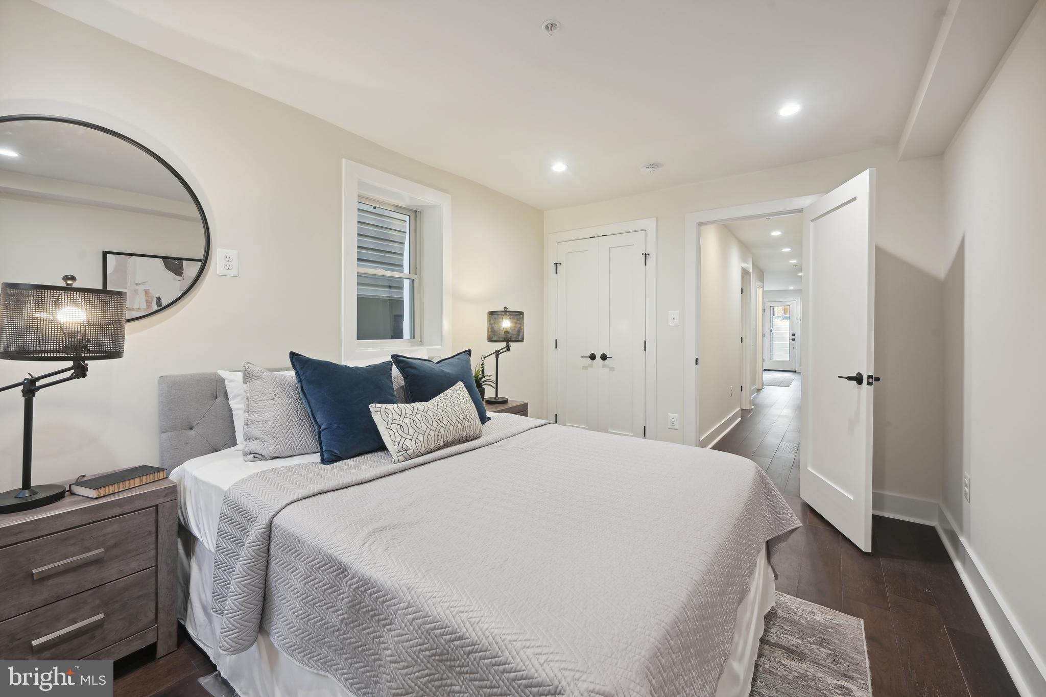 3657 13th Street Northwest Washington, DC 20010 - Photo 28 of 35 a bedroom with bed and a chandelier