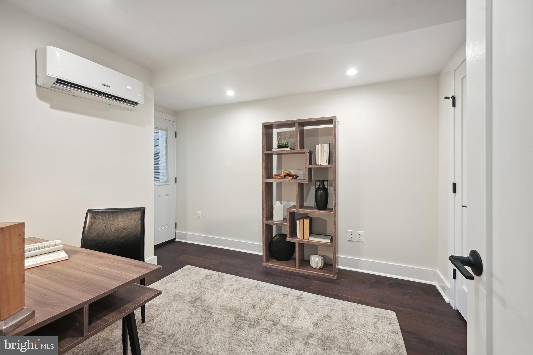 3657 13th Street Northwest Washington, DC 20010 - Photo 30 of 35 a view of a workspace with furniture and wooden floor