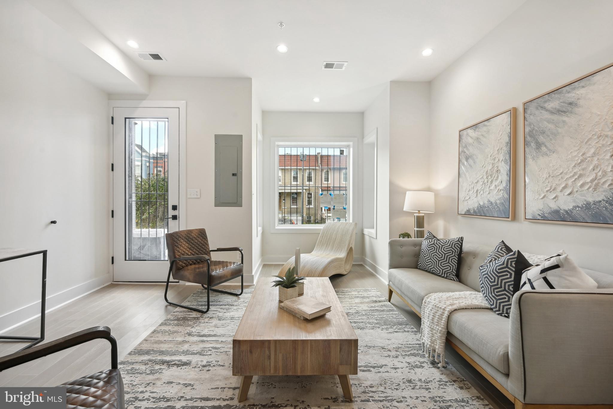 3657 13th Street Northwest Washington, DC 20010 - Photo 3 of 35 a living room with furniture and a window