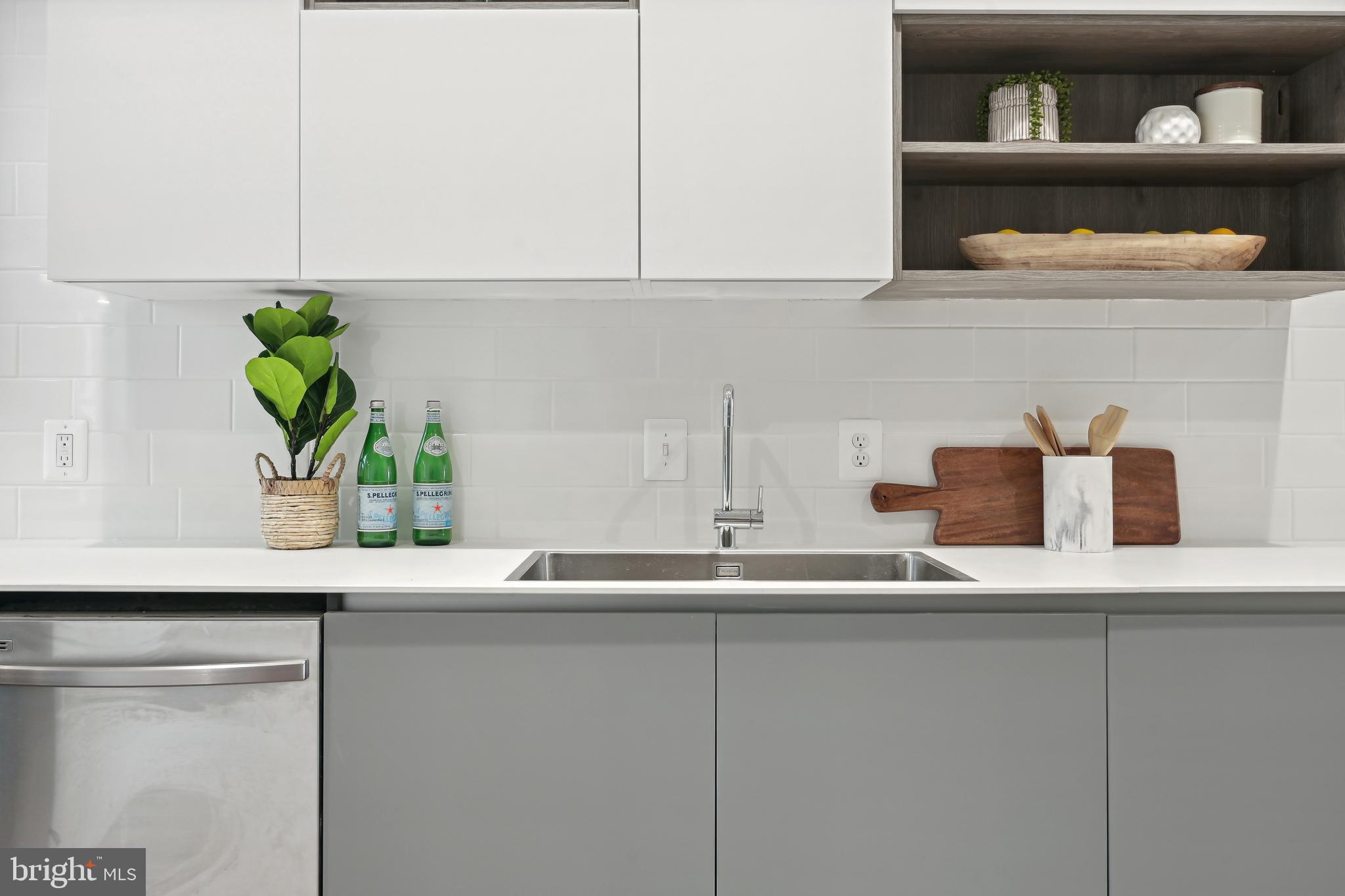 3657 13th Street Northwest Washington, DC 20010 - Photo 8 of 35 a kitchen with white cabinets and a sink