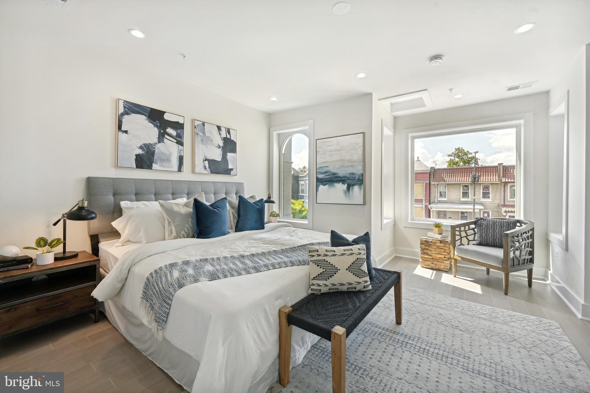 3657 13th Street Northwest Washington, DC 20010 - Photo 10 of 35 a bed room with a bed and a chair