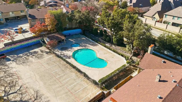 an aerial view of a house with a swimming pool