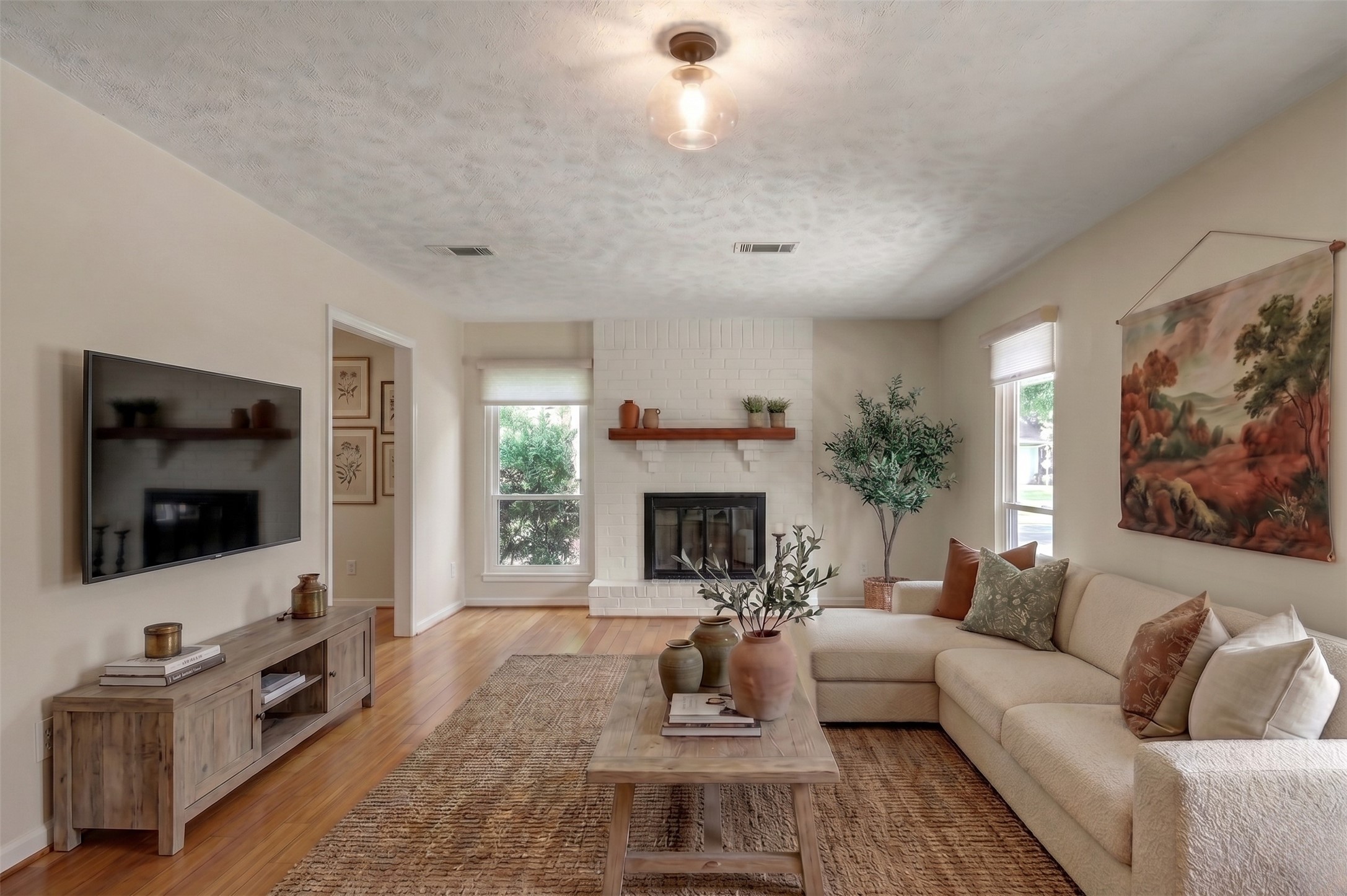 12224 Gun Oak Place Spring, TX 77380 - Photo 4 of 37 Warm and Inviting Living Room Centered Around a Beautiful Fireplace, Welcomes you to 12224 Gun Oak Pl. (Virtually Staged)