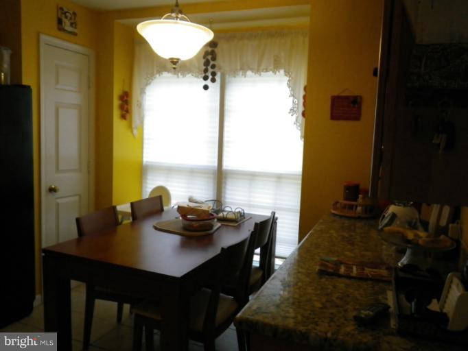 8222 Maple Ridge Avenue Springfield, VA 22153 - Photo 11 of 15 a view of a workspace with furniture and window
