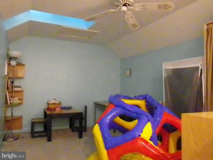 8222 Maple Ridge Avenue Springfield, VA 22153 - Photo 5 of 15 a room with a bed and a workspace