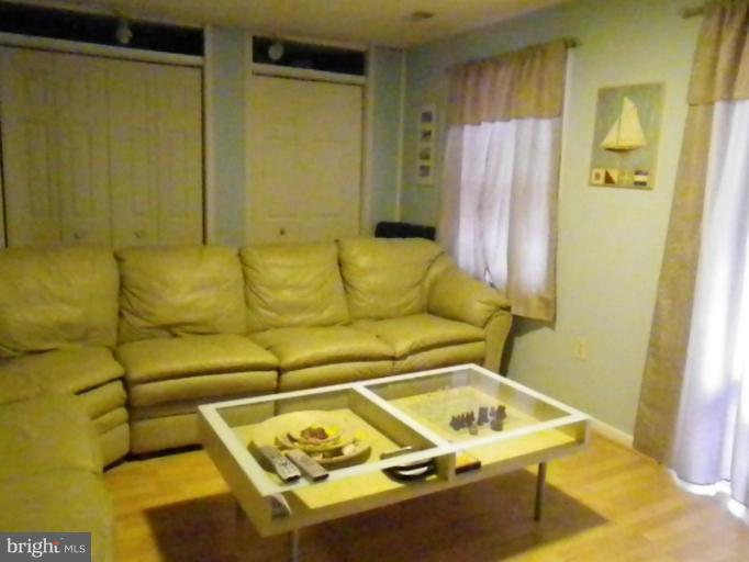 8222 Maple Ridge Avenue Springfield, VA 22153 - Photo 8 of 15 a blue bath tub sitting next to a blue sink and a shower