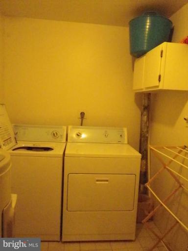 8222 Maple Ridge Avenue Springfield, VA 22153 - Photo 10 of 15 a utility room with dryer and washer