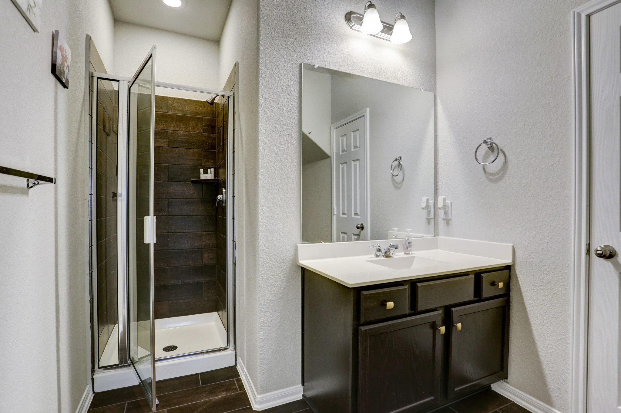 5414 Rustic Ruby Drive Fulshear, TX 77423 - Photo 13 of 26 There is a third full bathroom with its own shower and extended vanity.