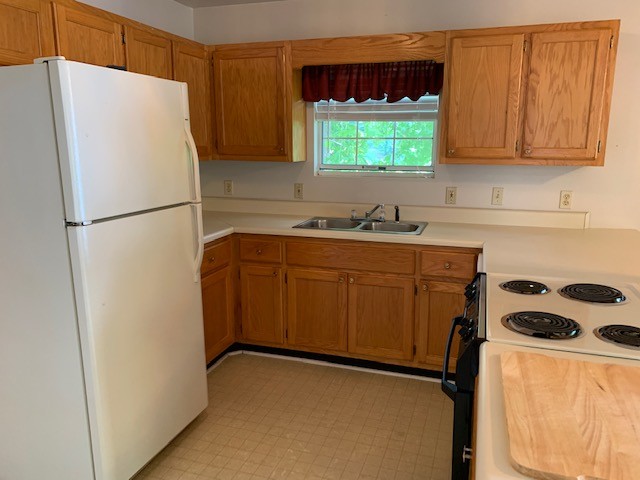323 Cosby Parris Road Byrdstown, TN 38549 - Photo 3 of 28 a white refrigerator freezer sitting inside of a kitchen