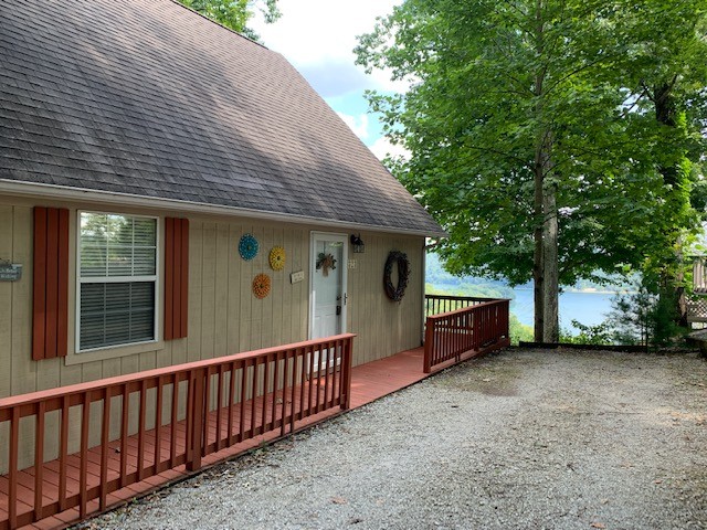 323 Cosby Parris Road Byrdstown, TN 38549 - Photo 23 of 28 a view of a house with a backyard