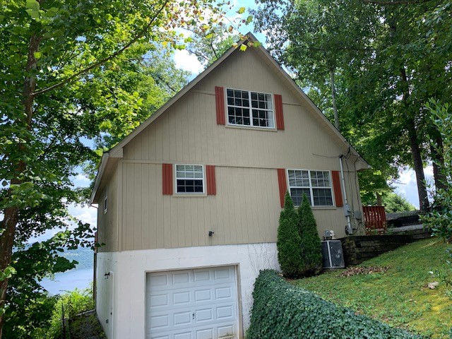 323 Cosby Parris Road Byrdstown, TN 38549 - Photo 28 of 28 a front view of a house with a yard
