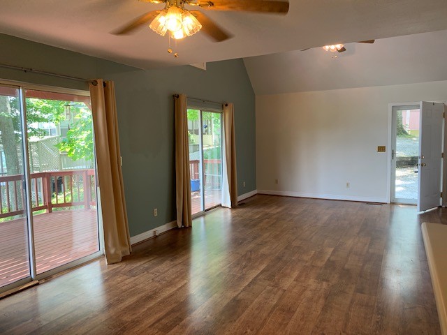 323 Cosby Parris Road Byrdstown, TN 38549 - Photo 6 of 28 an empty room with wooden floor and windows