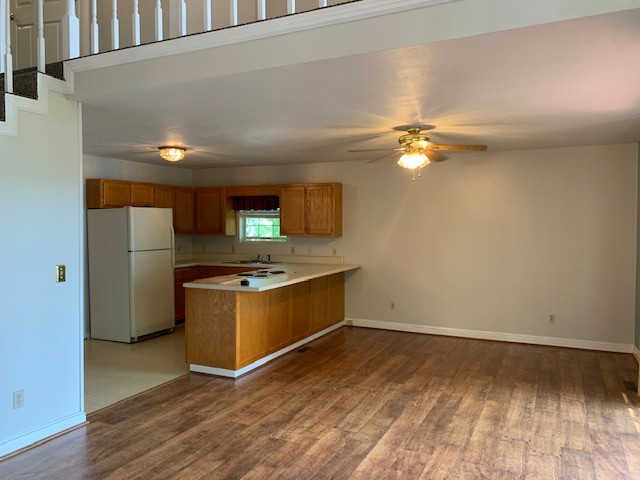 323 Cosby Parris Road Byrdstown, TN 38549 - Photo 7 of 28 a kitchen with stainless steel appliances a stove and a refrigerator