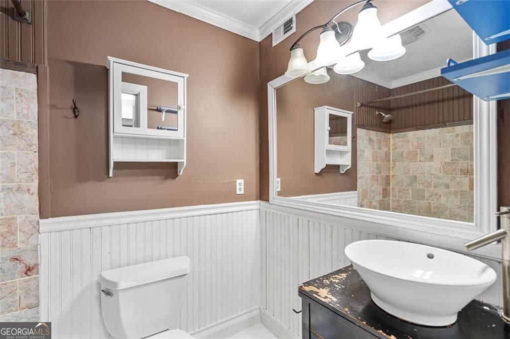 2045 Brian Way Decatur, GA 30033 - Photo 18 of 35 a bathroom with a toilet sink and mirror