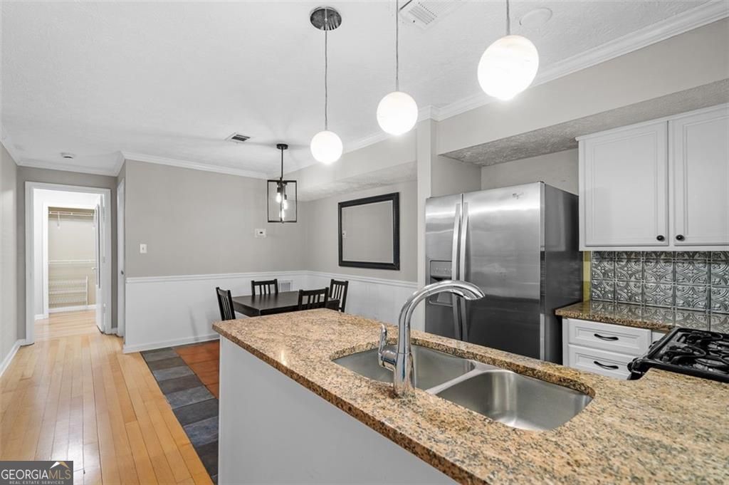2045 Brian Way Decatur, GA 30033 - Photo 8 of 35 a kitchen with stainless steel appliances granite countertop a sink a refrigerator and a stove