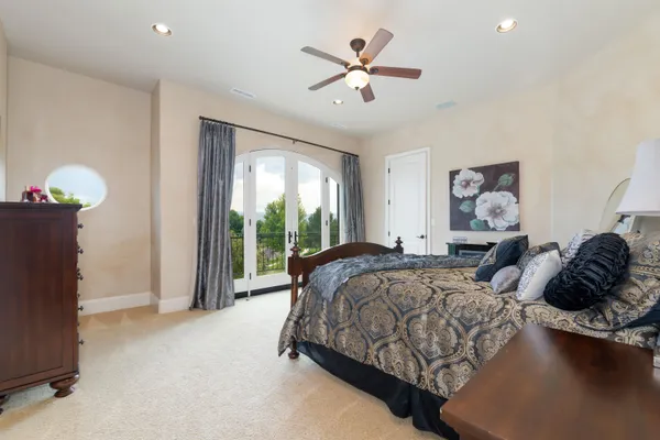 a bedroom with bed and window