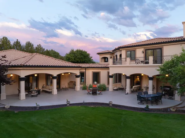 a view of a house with table and chairs