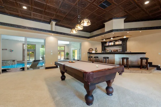 a room with furniture and pool table