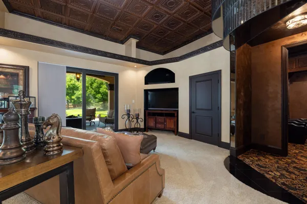 a living room with furniture fireplace and flat screen tv