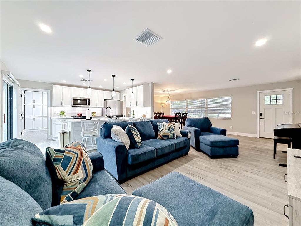 508 Shore Drive Largo, FL 33771 - Photo 5 of 31 a living room with furniture and kitchen view