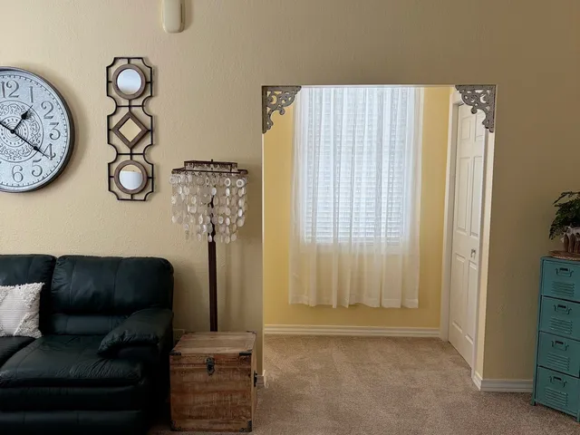 a living room with furniture and a window