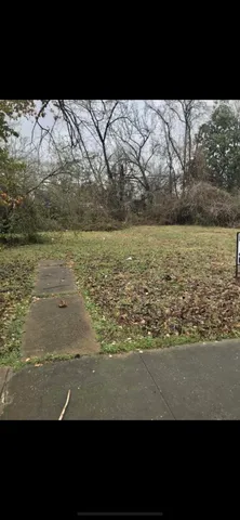 a view of a lake with a yard