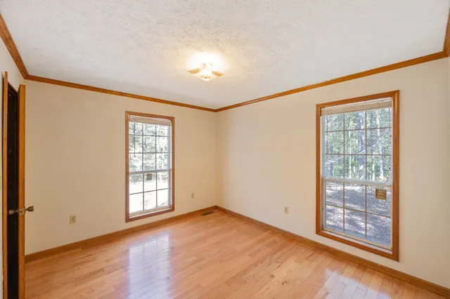 a view of roof with wooden floor and a pot
