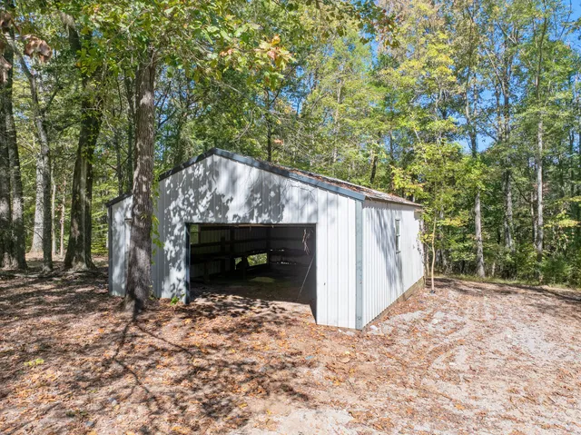 a backyard of a house with fireplace and outdoor seating