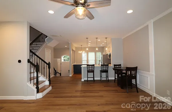 a view of kitchen with dining room and hall