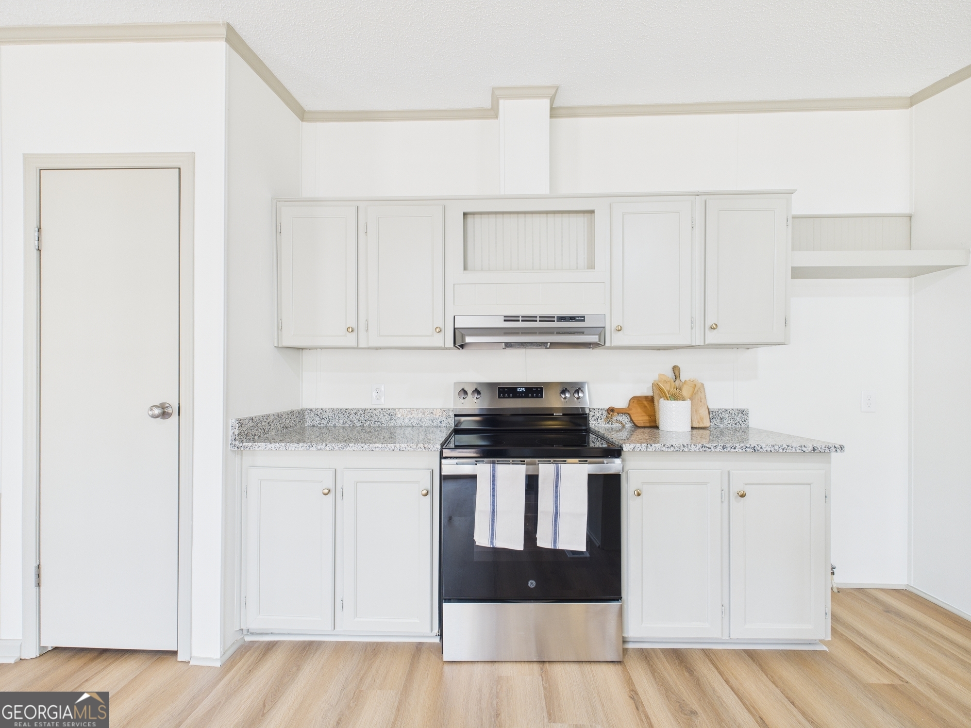 1669 Henderson Road Macon, GA 31217 - Photo 14 of 48 a kitchen with stainless steel appliances a sink and a refrigerator