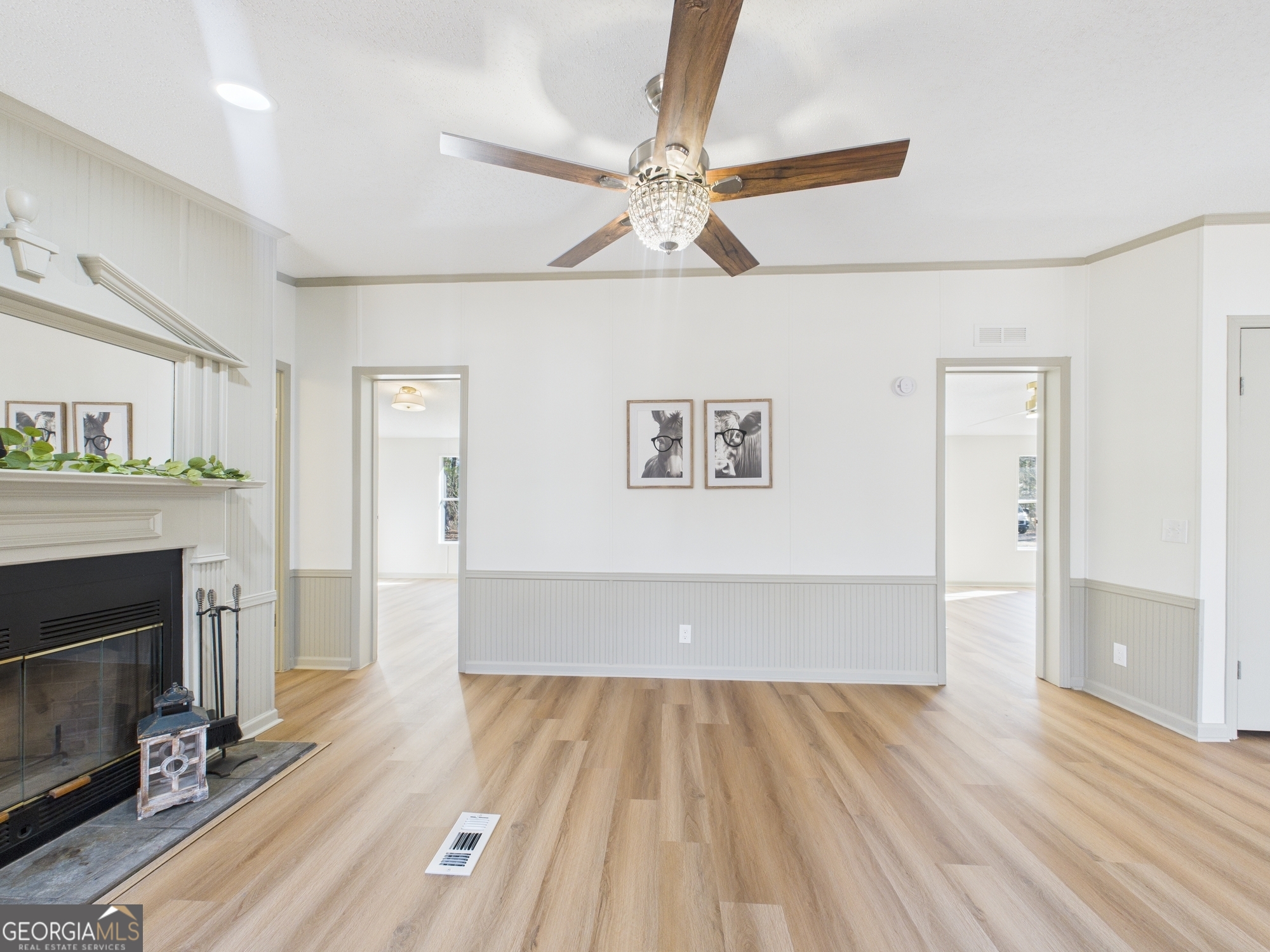 1669 Henderson Road Macon, GA 31217 - Photo 18 of 48 a view of livingroom with hardwood floor and a ceiling fan